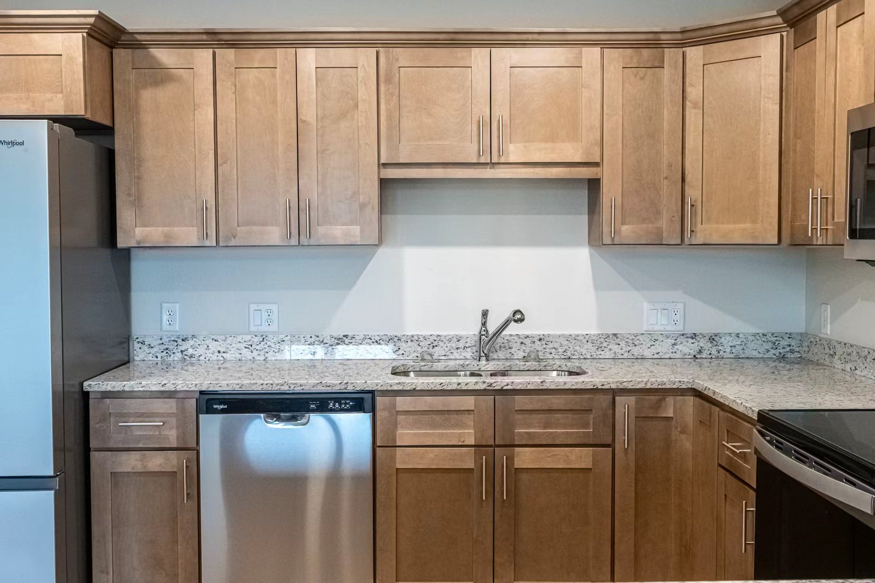 Installed kitchen countertop and cabinetry in a completed project